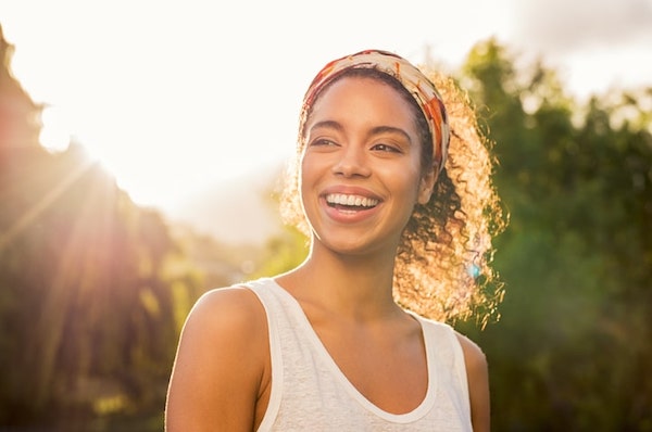 woman smiling in sun